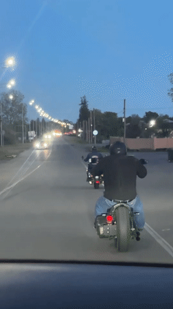 Two motorcyclists spotted on streetlit road in Pshap, Abkhazia