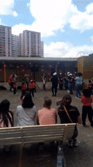 Children dance in Caracas courtyard as community gathers