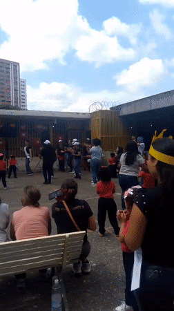 Children dance in Caracas courtyard as community gathers