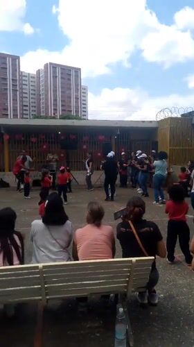 Children dance in Caracas courtyard as community gathers