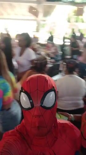 Costumed street performers entertain diners at Porlamar restaurant