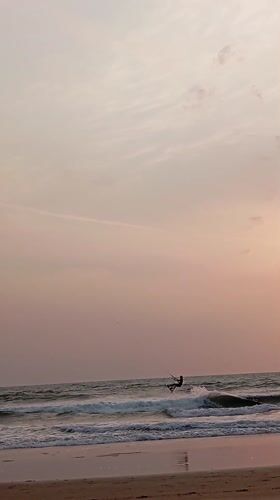 Kite surfer spotted at Arambol beach during dusk hours