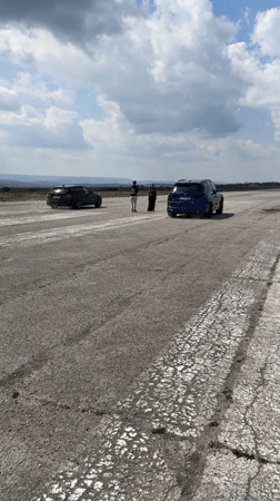 Two cars race on runway near Davidovo, Bulgaria