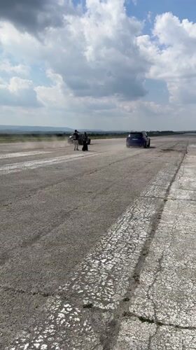 Two cars race on runway near Davidovo, Bulgaria