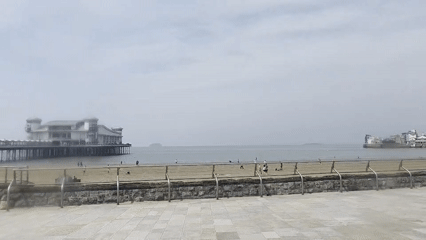 Weston-super-Mare's two piers seen from the beach