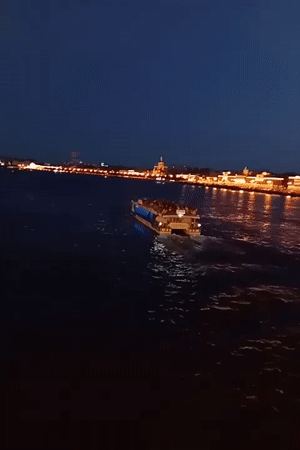 Saint Petersburg's drawbridges rise over the Neva at midsummer twilight