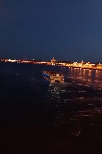 Saint Petersburg's drawbridges rise over the Neva at midsummer twilight