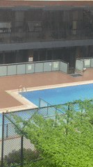 Rainy day swimming pool scene captured in Çekmeköy, Turkey