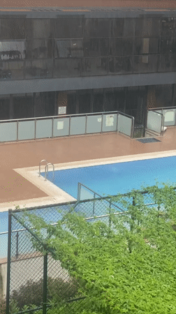 Rainy day swimming pool scene captured in Çekmeköy, Turkey