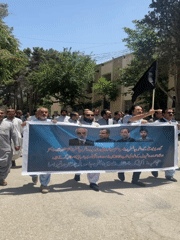 Men demonstrate with banners in Quetta, Pakistan