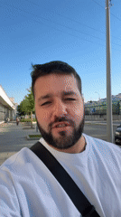 Man speaks to camera on Moscow walkway early morning