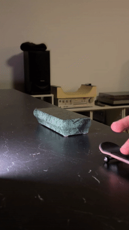 Person plays with finger skateboard in Yekaterinburg