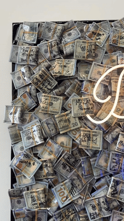 Cash bundles displayed on wall in New York