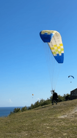 Paragliders soar over South Kuta and Benoa Indonesia