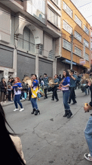 Street parade with dancers and marching band in La Paz