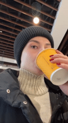 Woman enjoys morning coffee at Kyiv McDonald's food court