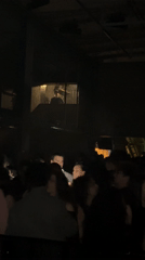 DJ performs in Paris nightclub as delivery activity continues