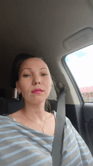 Woman photographed in driver's seat wearing striped top in Russia