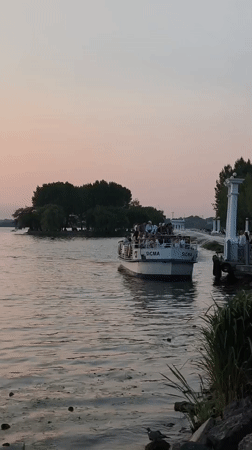 Summer sunset evening along Ternopil Lake's waterfront promenade