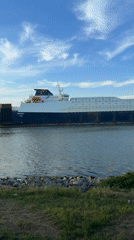 Evening life unfolds in Varna as cargo ships transit port