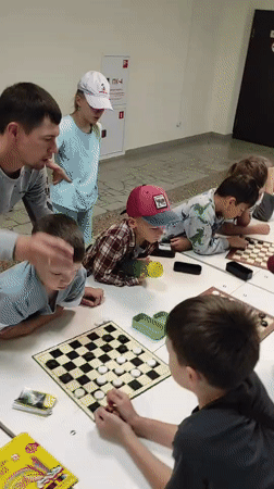 Kids' checkers tournament at a sports center in Noviy, Russia