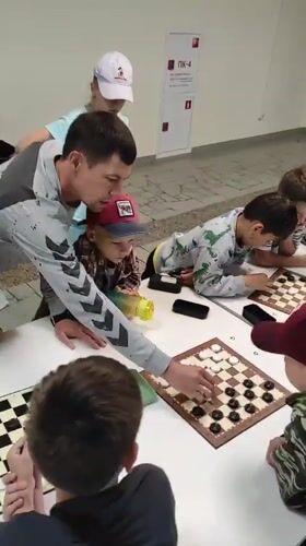 Kids' checkers tournament at a sports center in Noviy, Russia