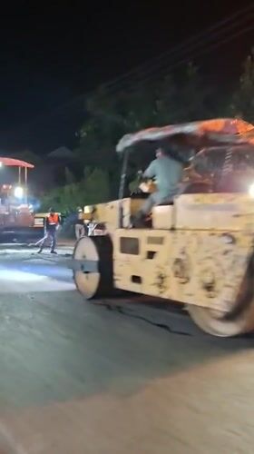 Night road paving underway in rural Aceh, Indonesia