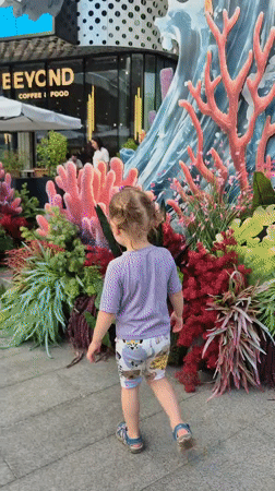 Colorful street scene outside a Moscow coffee and food spot
