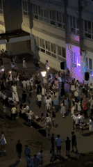 Youth dance gathering with DJ outside Kragujevac school building