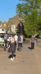 Sunny afternoon gathering in London park draws pedestrians