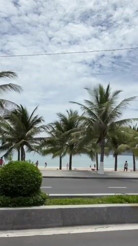 Cruising Nha Trang's beachfront road on a cloudy morning
