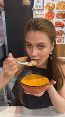 Woman enjoys restaurant meal in Krasnoyarsk