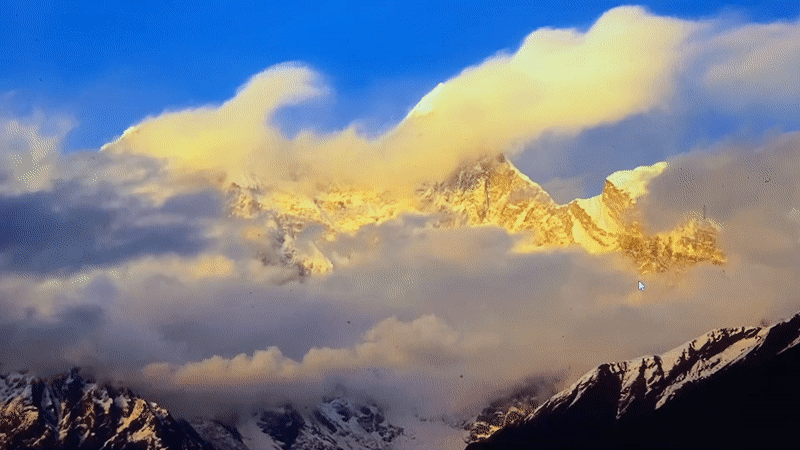 Snow-capped peaks and prayer flags at high altitude