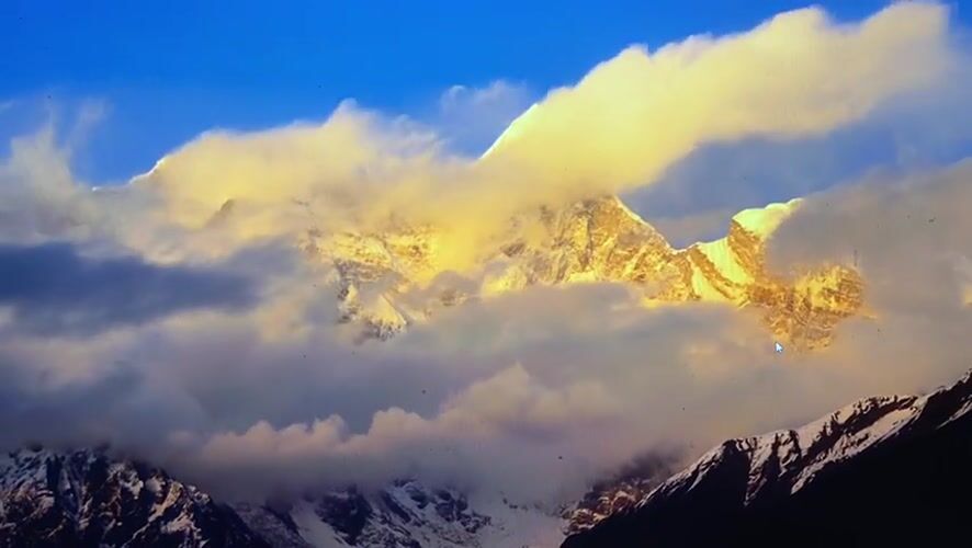 Snow-capped peaks and prayer flags at high altitude