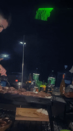 Late-night barbecue gathering with laser fishing in Iquique, Chile