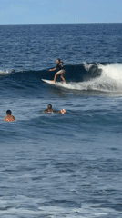 Surfers ride waves in General Luna waters during morning session