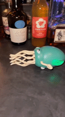Toy octopus robot crawls across cluttered Osaka kitchen counter