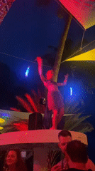 Woman performs dance with glowing sticks in Ban Haad Rin