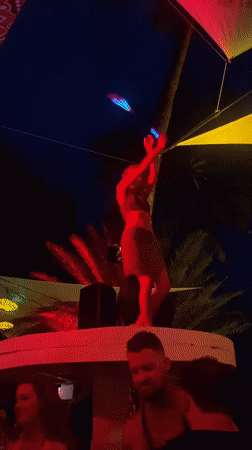 Woman performs dance with glowing sticks in Ban Haad Rin