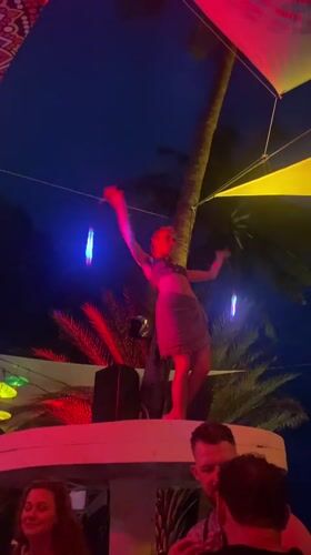 Woman performs dance with glowing sticks in Ban Haad Rin