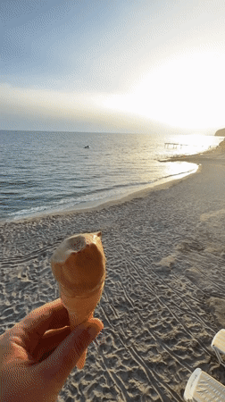 Ice cream moment captured on quiet Alanya beach