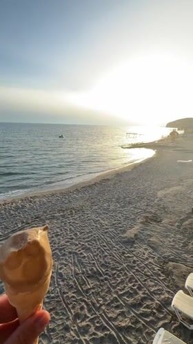Ice cream moment captured on quiet Alanya beach