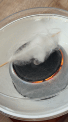 Girl watches cotton candy machine operation in Krasnoyarsk