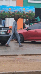 Urban morning activity: residents carry large items, van loaded