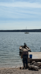 Family enjoys spring afternoon at Croatian coastal playground and pier