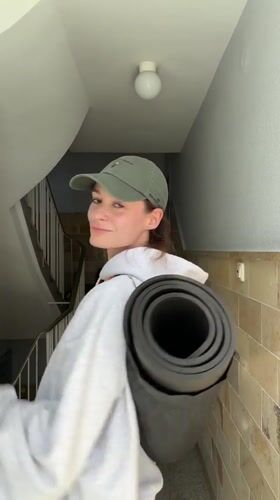 Woman takes selfies in Kiel building stairwell and elevator