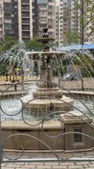 Mother and baby visit fountain in Odintsovo, Russia