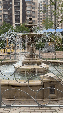 Mother and baby visit fountain in Odintsovo, Russia