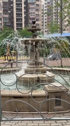 Mother and baby visit fountain in Odintsovo, Russia