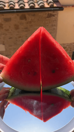Fresh watermelon split open in Tuscany's summer heat